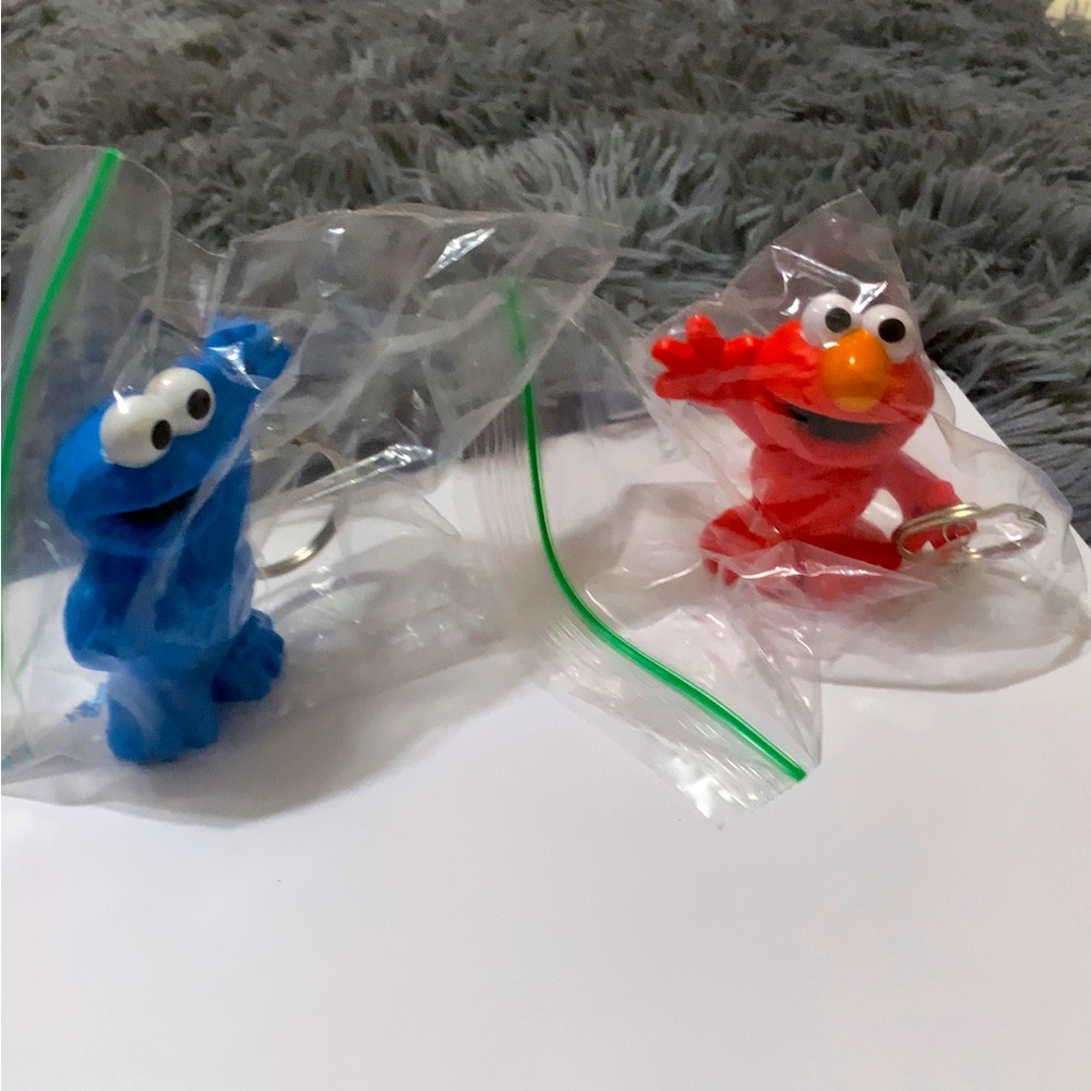 Handmade Cookie Monster an Elmo keychain. All new materials